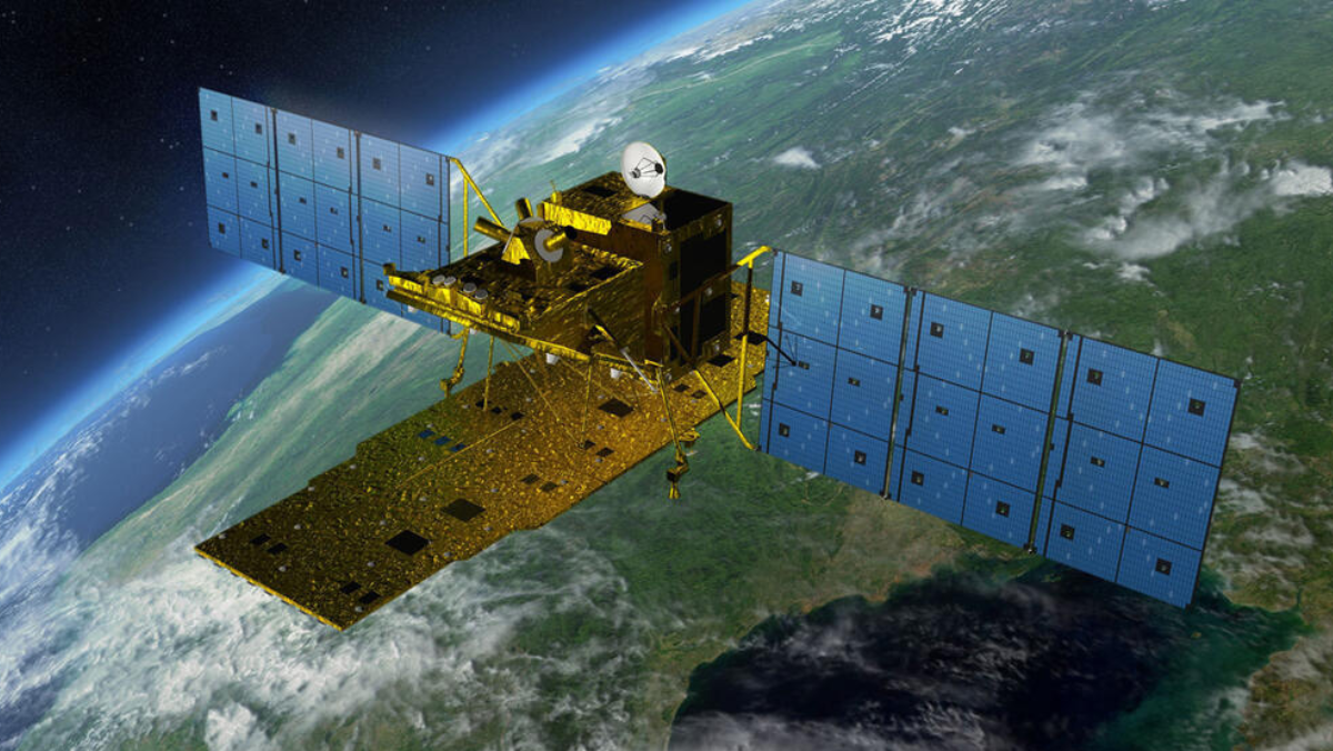 Satellite with extended solar panels orbiting above Earth.